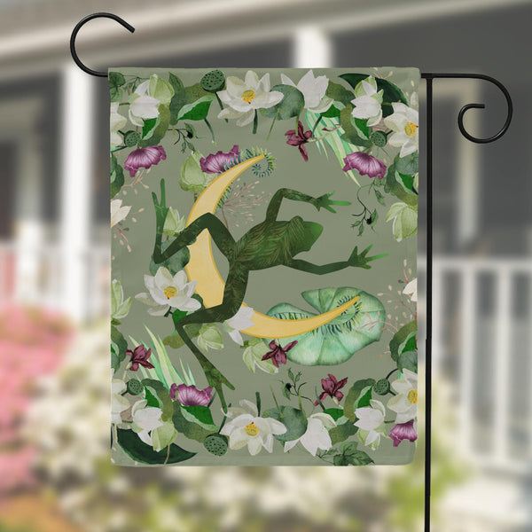 a flag with a frog on it hanging from a pole