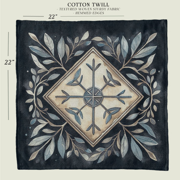 a black and white tile with leaves and a cross