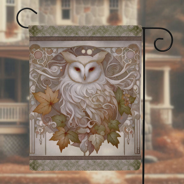 a picture of an owl with leaves on it