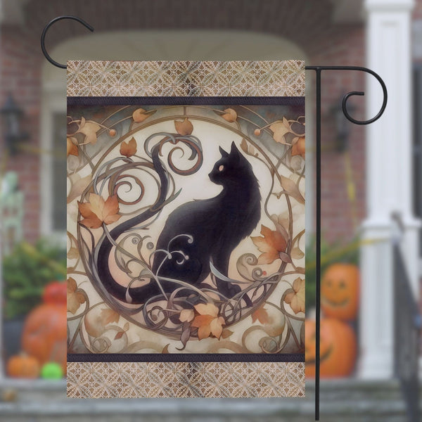 a black cat sitting on top of a metal pole