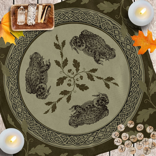 a table with candles, a plate with owls and leaves on it