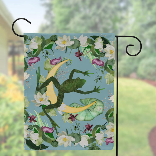 a flag with a frog and flowers on it