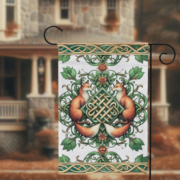 a decorative flag hanging from a metal pole