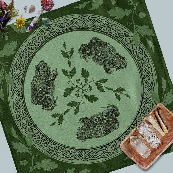 a green table cloth with a picture of two owls on it