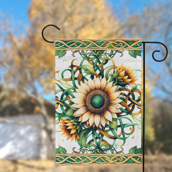a decorative sunflower is hanging from a pole