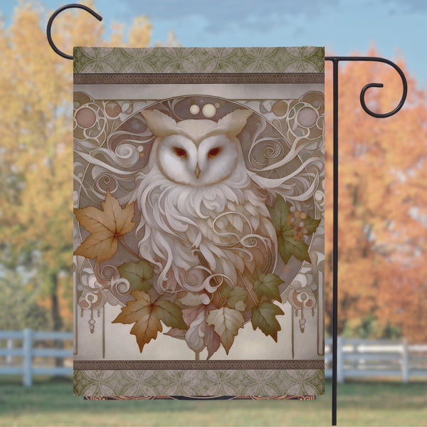 a picture of an owl with leaves on it
