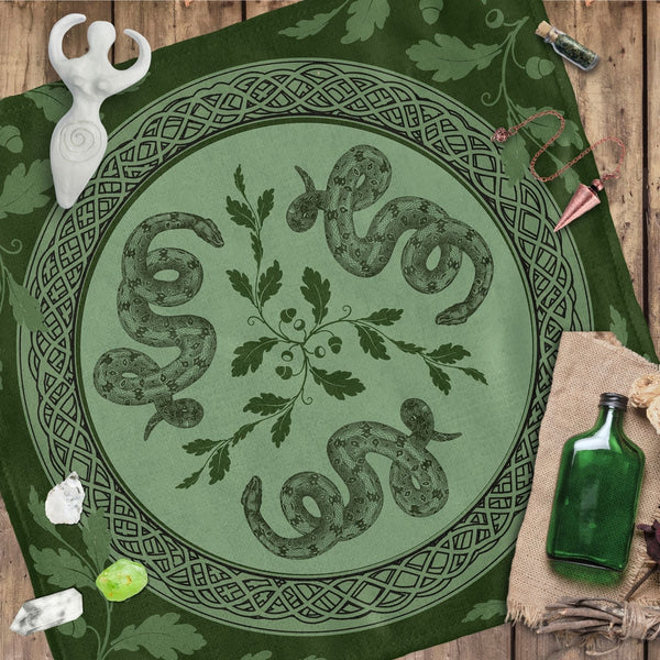 a green table cloth with a picture of a snake on it