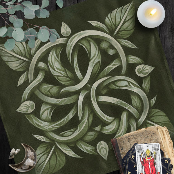 a table topped with a book and a candle