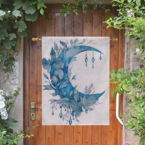 a painting of a blue moon hanging on a wooden door